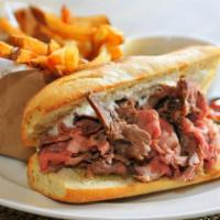 French Dip Sandwich · Mouthwatering House special sandwich prepared with thinly sliced roast beef on a toasted rol...