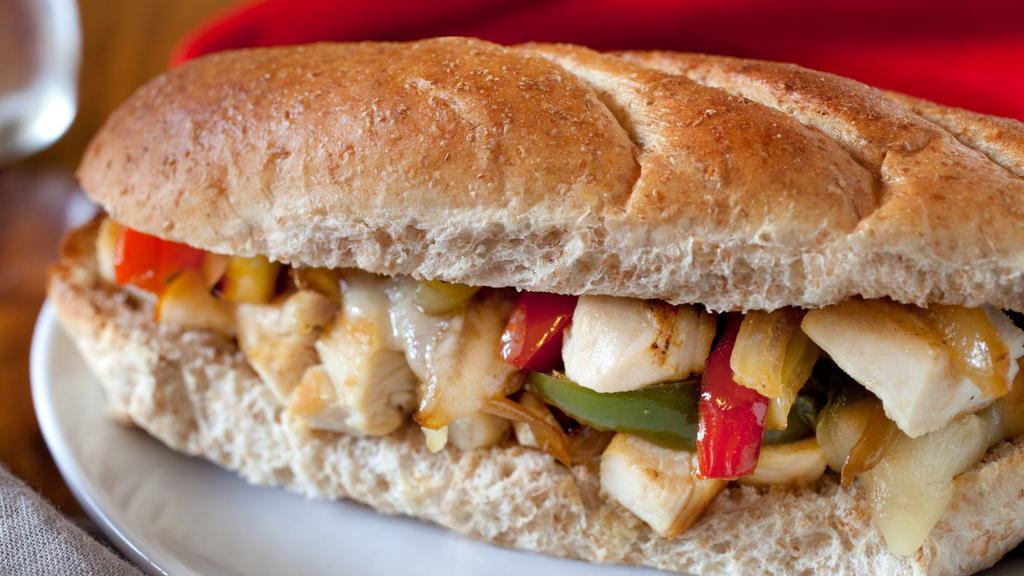 Chicken Philly Sandwich · Mouthwatering House special sandwich prepared with Marinated grilled chicken, sautéed peppers and onions, and Swiss cheese on a toasted hoagie roll. Served with customer's choice of side.