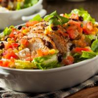 Cilantro Lime Chicken Salad · Fresh & Delicious salad prepared with mixed greens, grilled chicken breast, black beans, pic...