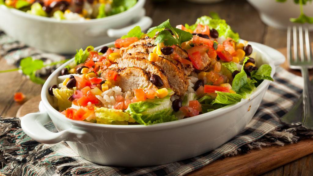 Cilantro Lime Chicken Salad · Fresh & Delicious salad prepared with mixed greens, grilled chicken breast, black beans, pico de gallo and fresh diced mango, tossed in a house-made cilantro lime vinaigrette dressing. Served with chipotle sour cream.