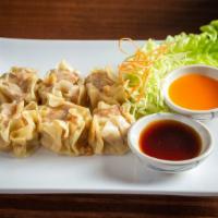 Shumai Dumplings · Vegetarian. Wonton skin wrapped dumpling filled with chicken and shrimp. Served with a side ...