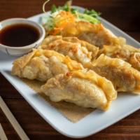 Veggie Pot Stickers · Vegetarian. Wonton skin wrapped dumpling filled with tofu, cabbage, and onions. Served with ...