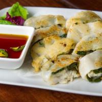 Chive Dumplings · Vegetarian. Thick dough dumplings filled with chives. Served with a side of sweet chili soy ...