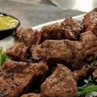 Steak Bites · Hand cut steak, garlic pepper, dijon horseradish, chimichurri.
