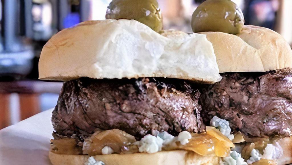 Filet Slyders · Beef tenderloin medallions, caramelized onions, bleu cheese crumbles, queen olive skewer. *served medium rare (cool red center).
