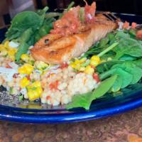 Salmon Chopped Salad · Chilled chopped salmon, pico de gallo, oven-roasted corn, baby spinach, toasted pumpkin seed...
