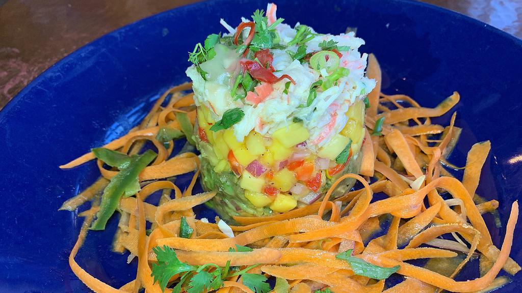 Crab Stacked Salad · Romaine lettuce, jumbo lump crab, mango and guacamole stacked with sweet and spicy vinaigrette dressing.