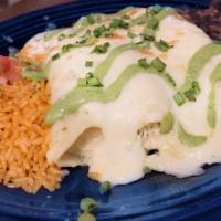 Sharon’S Chicken Enchiladas - Lunch Portion · Chicken and cheese enchiladas with white sauce, poblano sauce, 
beans and rice.