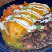 Green Chile Chicken Burrito · Slow roasted pulled chicken burrito smothered in pueblo green Chile with sour cream, rice, a...