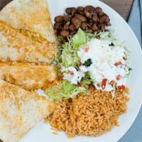 Quesadillas · Melted cheese on a flour tortilla, choice of meat. Served with a side of homemade rice and b...