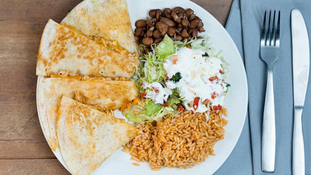 Quesadillas · Melted cheese on a flour tortilla, choice of meat. Served with a side of homemade rice and beans, sour cream, lettuces, and pico de gallo.