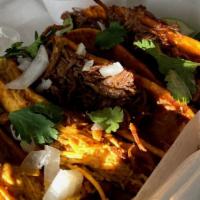 Birria Tacos · Flour tortillas filled with stewed beef or chicken and cheese. Then it's placed on the gridd...