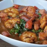 Shrimp & Grits · Pan blackened shrimp, andouille sausage, smoked ham, veggies and gumbo sauce, served over ch...
