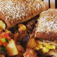 Breakfast Challah · Challah bread French toast, scrambled eggs with cheese, bacon, sausage, and syrup. Served wi...