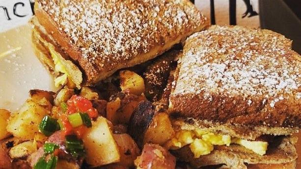 Breakfast Challah · Challah bread French toast, scrambled eggs with cheese, bacon, sausage, and syrup. Served with a side of Drunch home fries 