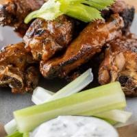 Smoked & Grilled Chicken Wings · Honey Adobo Sauce, Celery Sticks & Housemade Blue Cheese Dressing