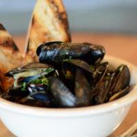 Hefeweizen Mussels · Wheat Beer, Heavy Cream, Butter, Garlic, Shallots, Chives, Grilled Baguette & . Parmesan Fries
