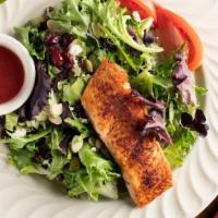 Wood Grilled Salmon Salad · Gluten-free. Grilled salmon, served atop a bed of mixed spring greens, accompanied by sliced...