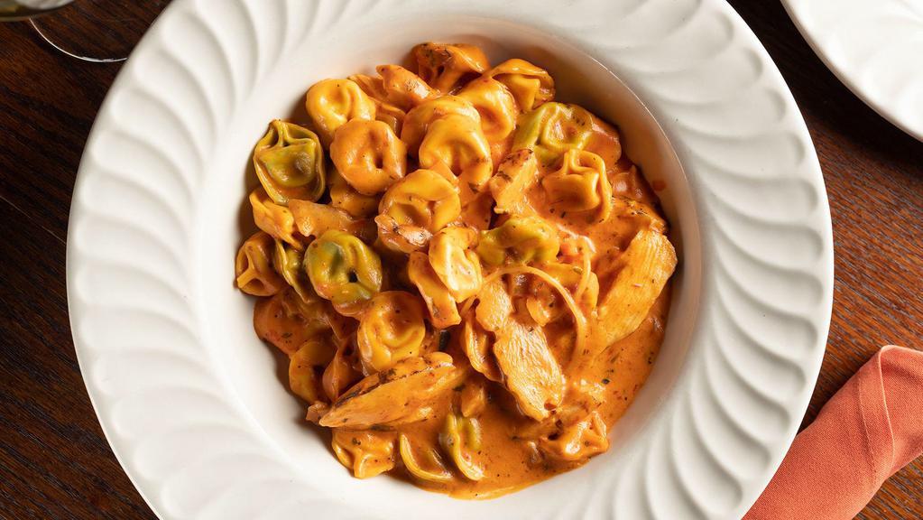 Pollo Tortellini · Tri-colored tortellini noodles stuffed with cheese and joined with strips of grilled chicken breast topped with our own creamy palomino sauce.