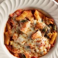 Baked Pollo Rigatoni · Imported rigatoni in a chunky tomato-spinach, olive oil sauce, topped with grilled chicken a...