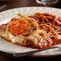 Eggplant Parmigiana · Breaded eggplant layered with tomato sauce and cheeses.
