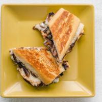 Chicken Pepito Sandwich By Irazu · By Irazu. Chicken with sauteed onions, cheese, black beans, and lizano sauce. Served on Fren...