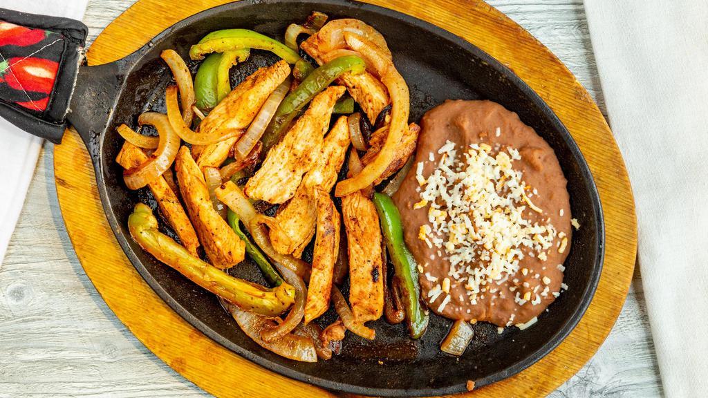 L-3. Chicken Fajitas · Broiled and marinated strips of chicken breast, sautéed with Spanish onions, tomatoes and bell peppers.