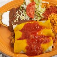 Enchiladas Suizas · Three enchiladas with your choice of beef, chicken, or pork covered with melted cheddar chee...