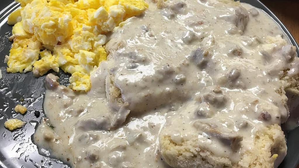 Trail Boss - Biscuits And Gravy · Oven warmed biscuits smothered in our from scratch peppered sausage gravy, served with 3 scramble eggs & 1 strip of Cherrywood bacon.