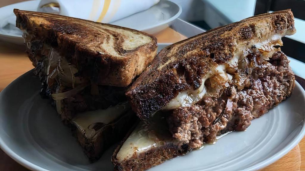Patty Melt · 1\2 lb of our Special grind Angus Chuck smashed on the grill with melted Swiss cheese and grilled Vidalia onions served on our excellent marble rye with chips or fries.