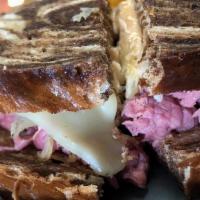 Time Square Reuben · Deli sliced corned beef with robust Swiss & sauerkraut. Our own deli dressing completes this...