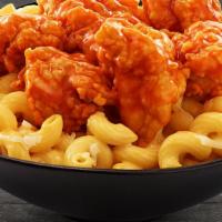 Buffalo Mac & Cheese · White meat chunks coated in Buffalo sauce and served over mac & cheese!