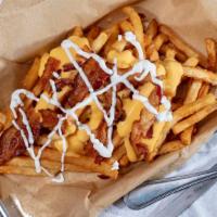 Loaded Fries · Bacon, cheddar cheese and sour cream.
