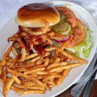 Bacon-N-Blue Burger · Bacon crumbled blue cheese, onion straws or twists, BBQ sauce, lettuce, tomato, onion and pi...