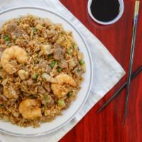 Combo Fried Rice · Chicken + beef + shrimps stir fry with fried rice, peas, egg and onions.