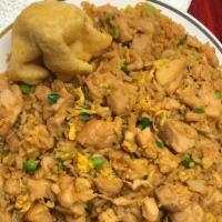 Chicken Fried Rice · Chicken stir fried with scrambled egg , onions and peas then seasoned to perfection with fri...