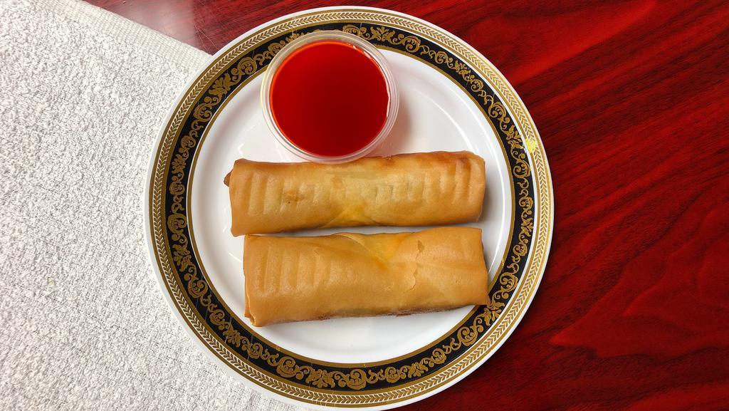 Spring Rolls (2) · 2 savory rolls stuffed with shredded vegetables, pork and shrimp  wrapped in a thin shell then fried to golden crisp.