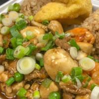 Combo Egg Foo Young · Chicken, beef and shrimps cooked in sweet brown sauce with green peas and fresh mushrooms sm...