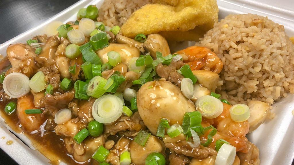 Combo Egg Foo Young · Chicken, beef and shrimps cooked in sweet brown sauce with green peas and fresh mushrooms smothered on egg patties then sprinkle with green onion.