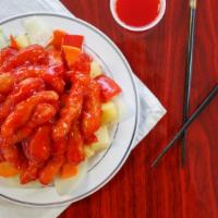 Sweet & Sour Chicken · Strips of battered chicken breast deep fried then smothered in Sweet n' Sour sauce on top of...
