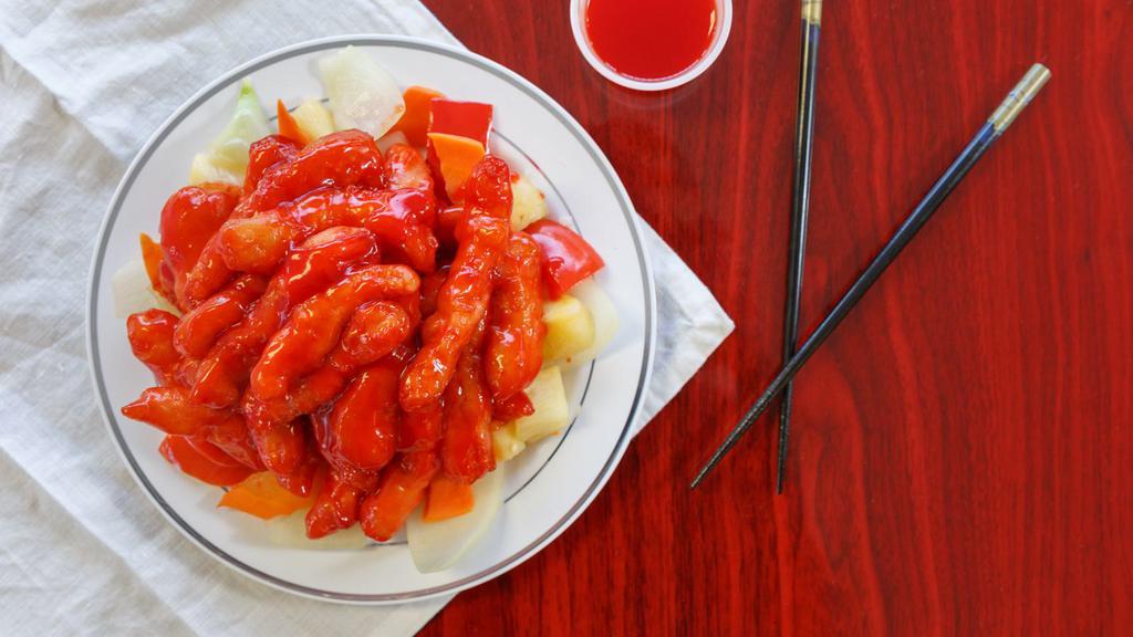 Sweet & Sour Chicken · Strips of battered chicken breast deep fried then smothered in Sweet n' Sour sauce on top of pineapple, carrot, red bell pepper and yellow onion.