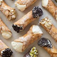 Cannoli · Hand stuffed cannolis' with powdered sugar and drizzled chocolate. Served 3 or 2 person.