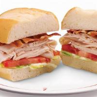 Turkey Club Combo · Sliced turkey breast with bacon, lettuce, tomatoes and mayonnaise on a toasted French roll.