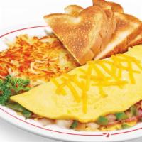 Western Omelet · Ham, onions and peppers, . topped with cheese.