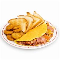 Farmers Omelet · Tomatoes, ham, potatoes and . onions, topped with cheese.