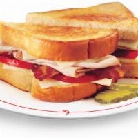 Club Melt Turkey · Sliced turkey with bacon, tomato and Swiss cheese grilled on Texas toast.