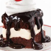 Hot Fudge Cake · Vanilla ice cream sandwiched between two fudge cakes, smothered with hot fudge and topped wi...