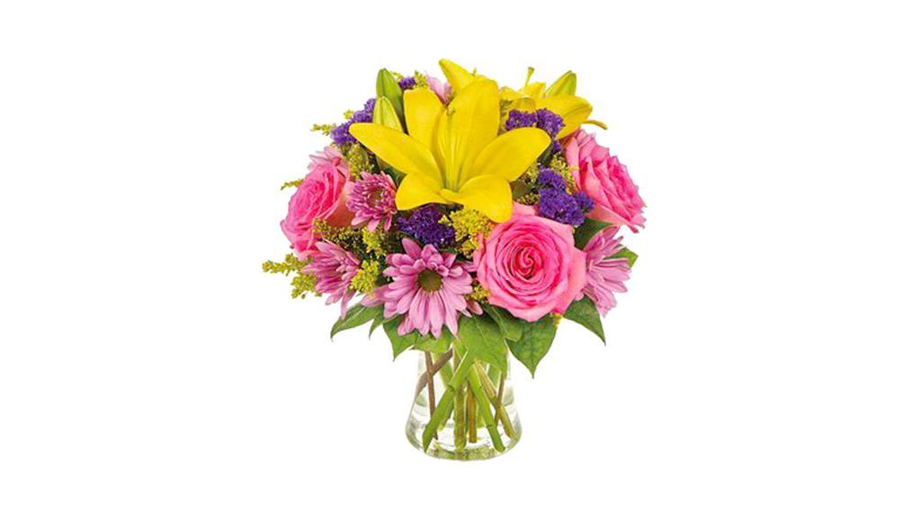 Spring Blossoms Bouquet · Thoughts of love blossom in beautiful bright colors, celebrating that very special mom in a spectacular way! Asiatic lilies, roses, carnations, daisy poms, statice and solidago are meticulously arranged in a graceful gathering vase. Measures 10