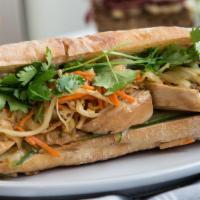 Chicken Banh Mi Sandwich · With pickled vegetables, cilantro and mayo on a baguette. (Jalapenos optional; please add to...