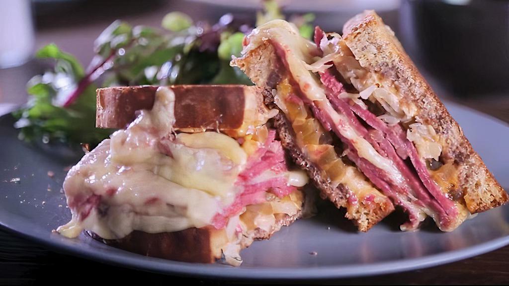 Corned Beef Sandwich · Made with jarlsberg cheese, pickled watermelon rind and russian dressing on rye.